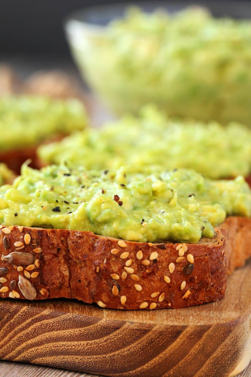 Avocado toast topped with black pepper. 