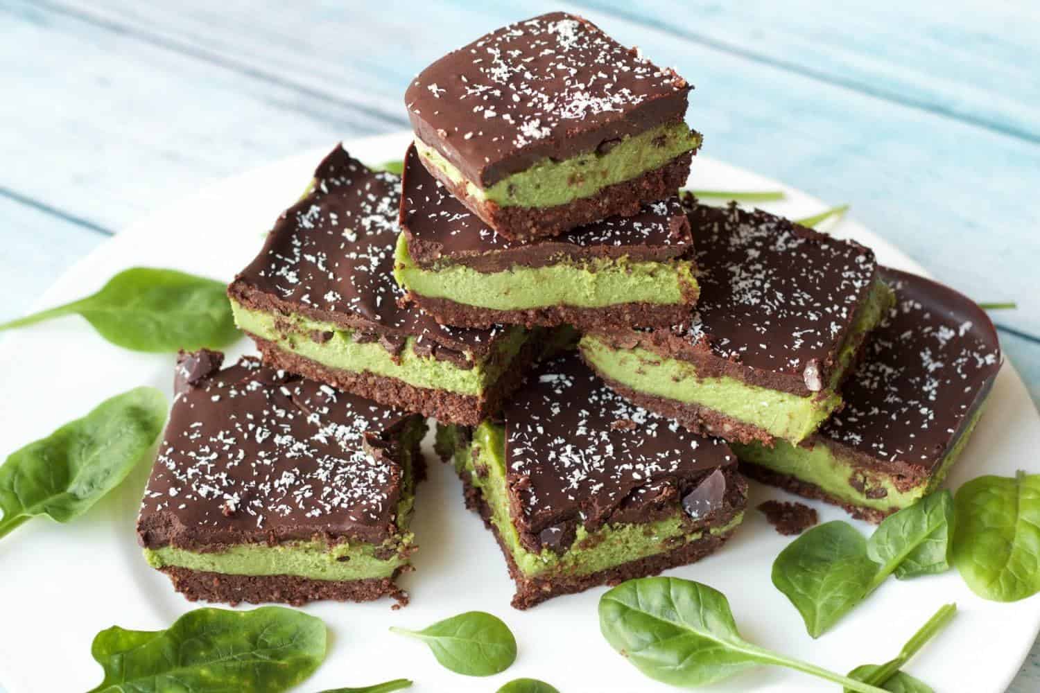 Raw mint slices stacked up on a white plate. 