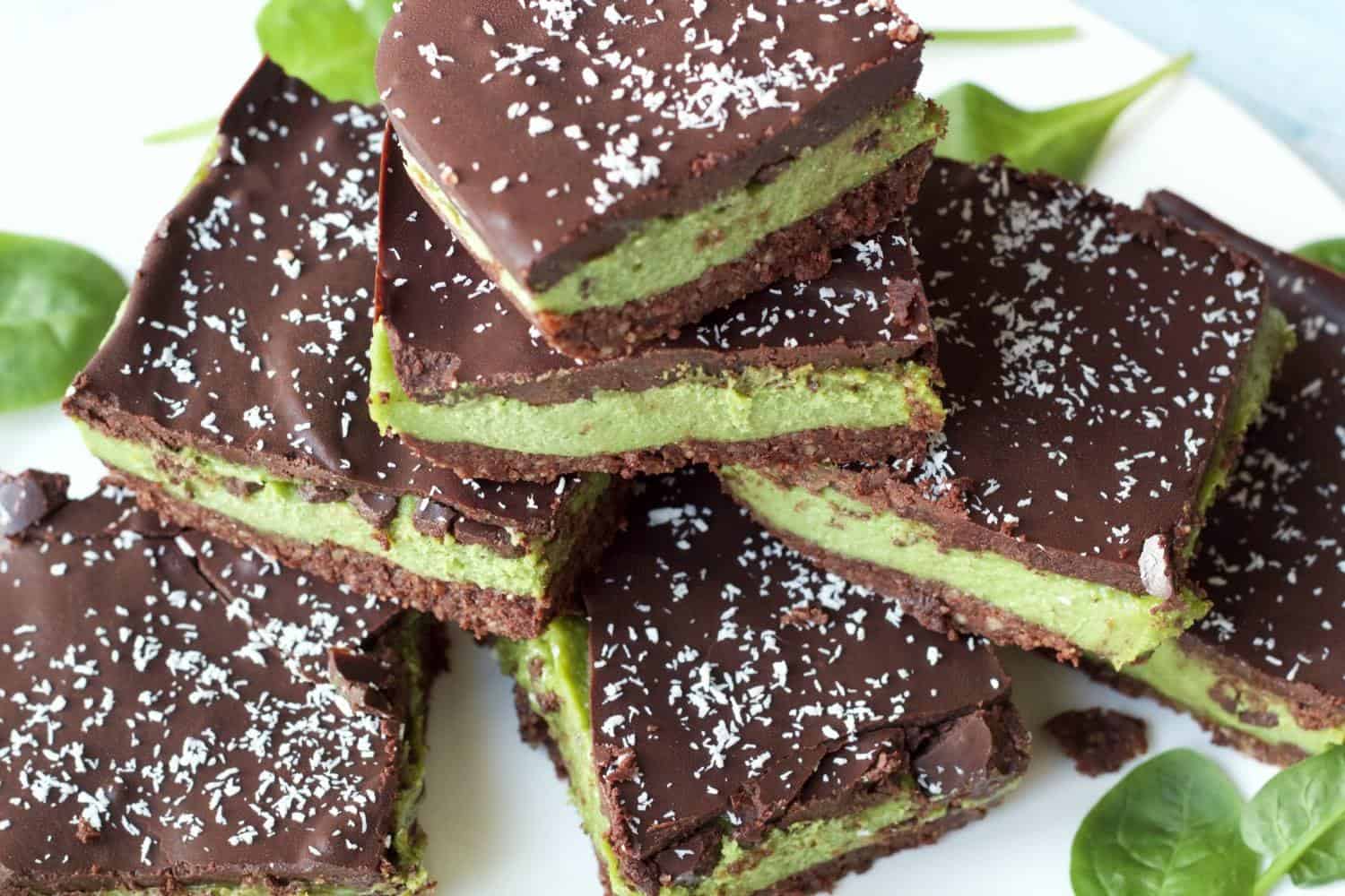 Raw mint slices in a stack on a white plate. 