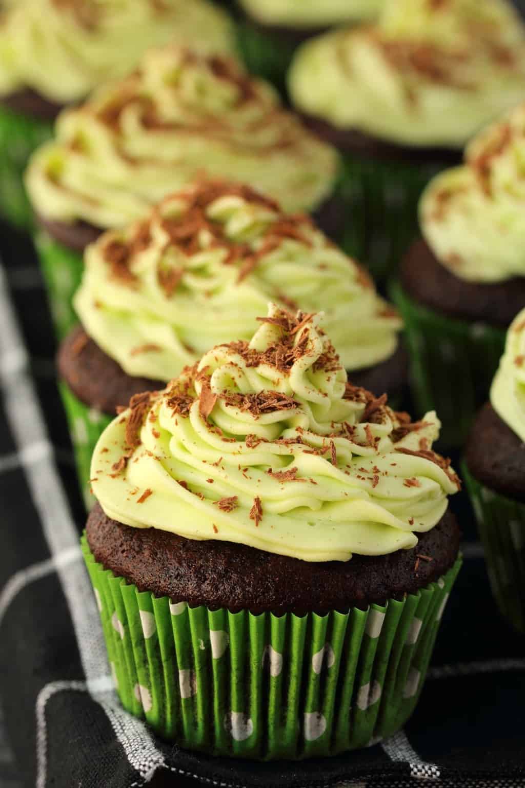 Vegan chocolate cupcakes topped with mint buttercream frosting.