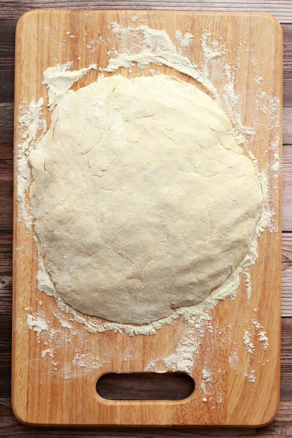 Dough for vegan scones on a wooden board. 