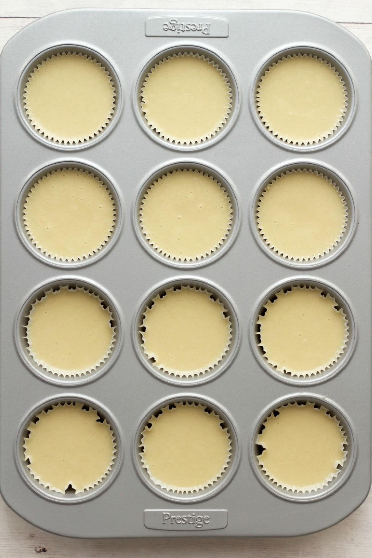 Cupcake batter in a cupcake tray ready to bake. 