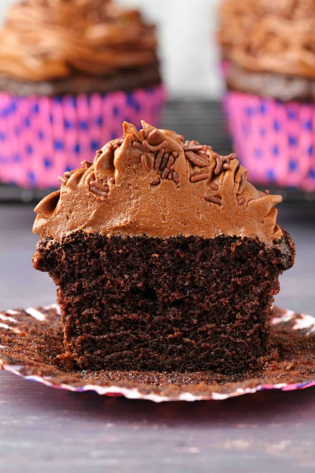 Chocolate cupcake cut in half to show the center. 