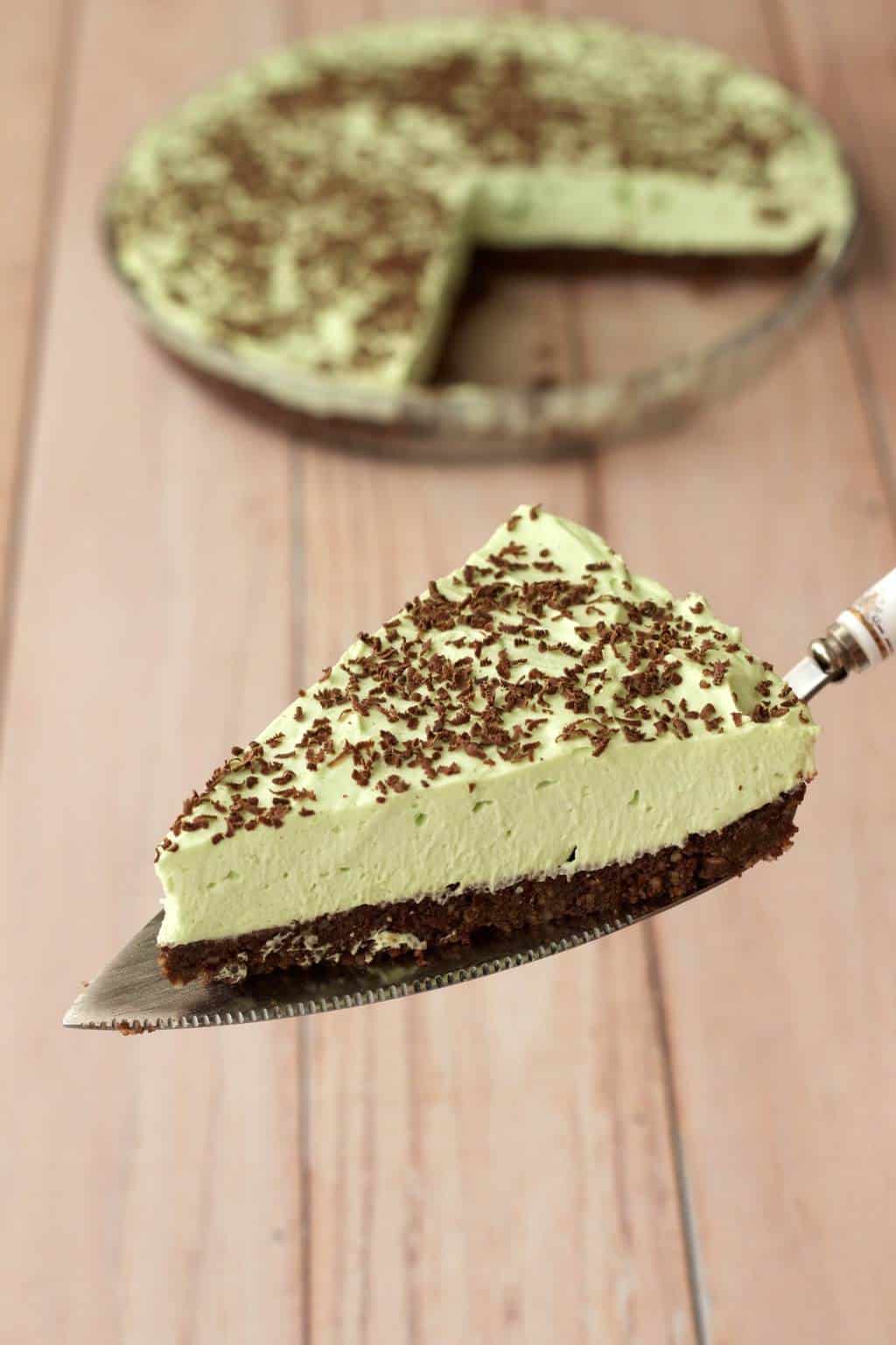Slice of vegan grasshopper pie on a cake lifter. 