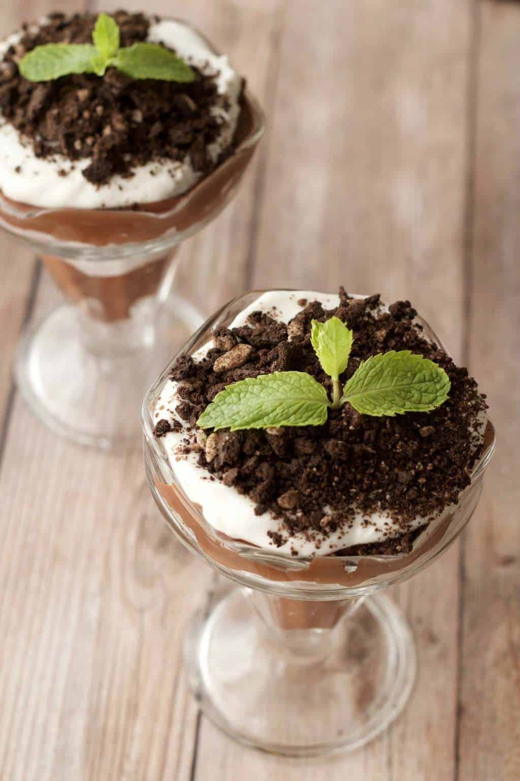 Vegan parfaits topped with sprigs of fresh mint. 