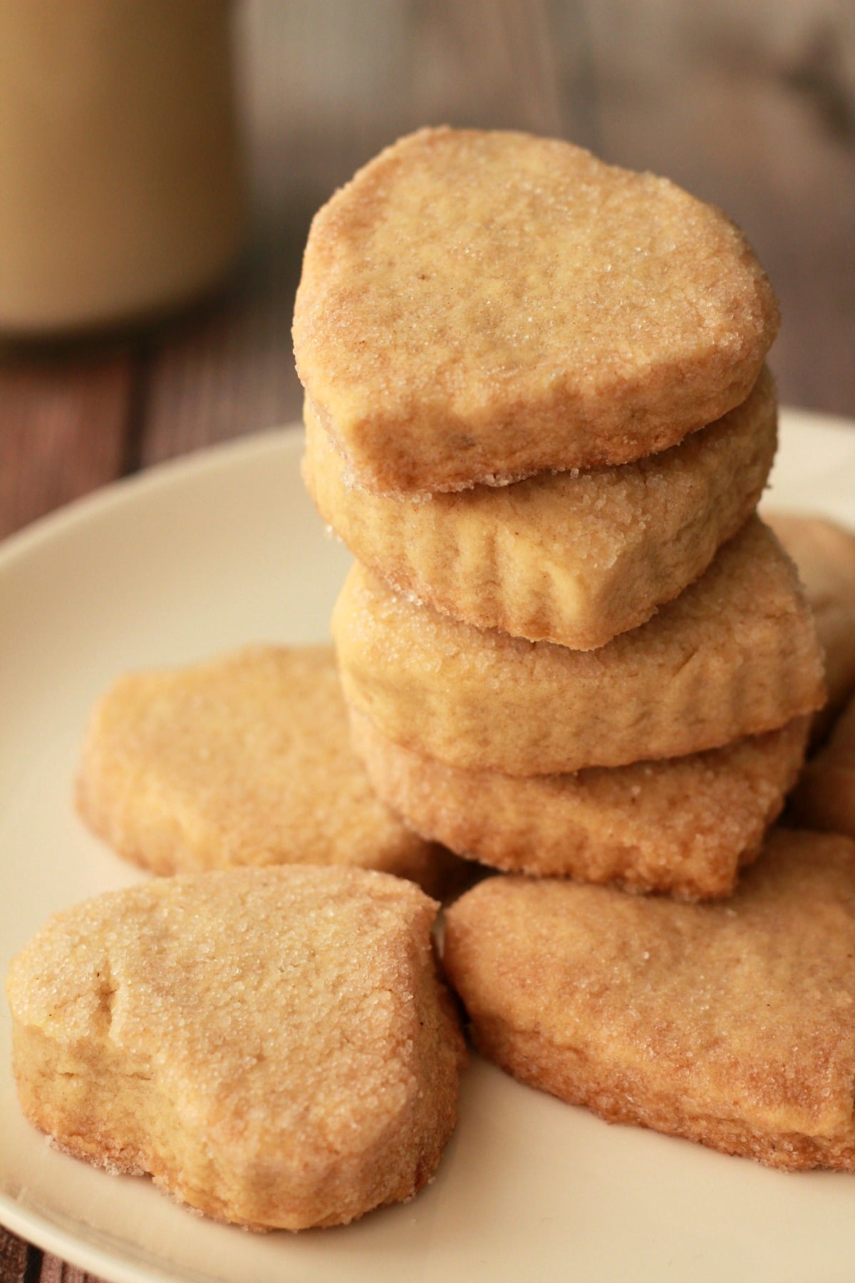 Vegan shortbread cookies in a stack on a white plate. 