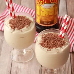 Kahlua dom pedros in glasses with short straws.