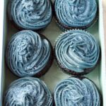 Vegan blue velvet cupcakes in a box.