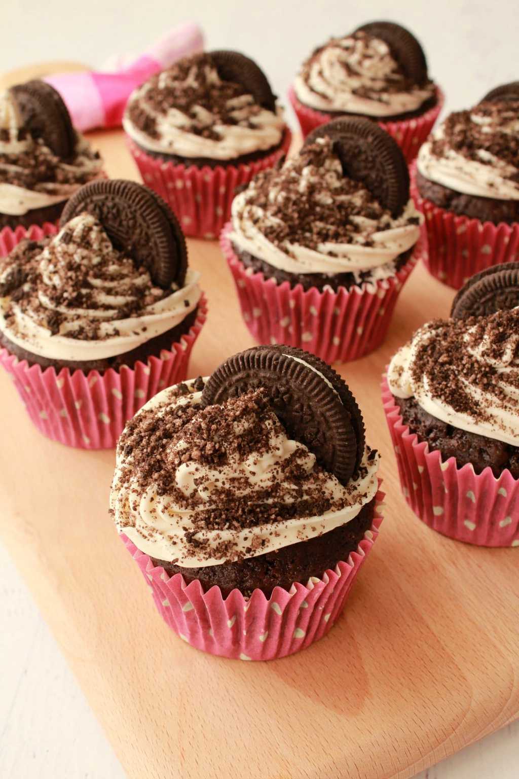 Oreo cupcakes on a wooden board. 