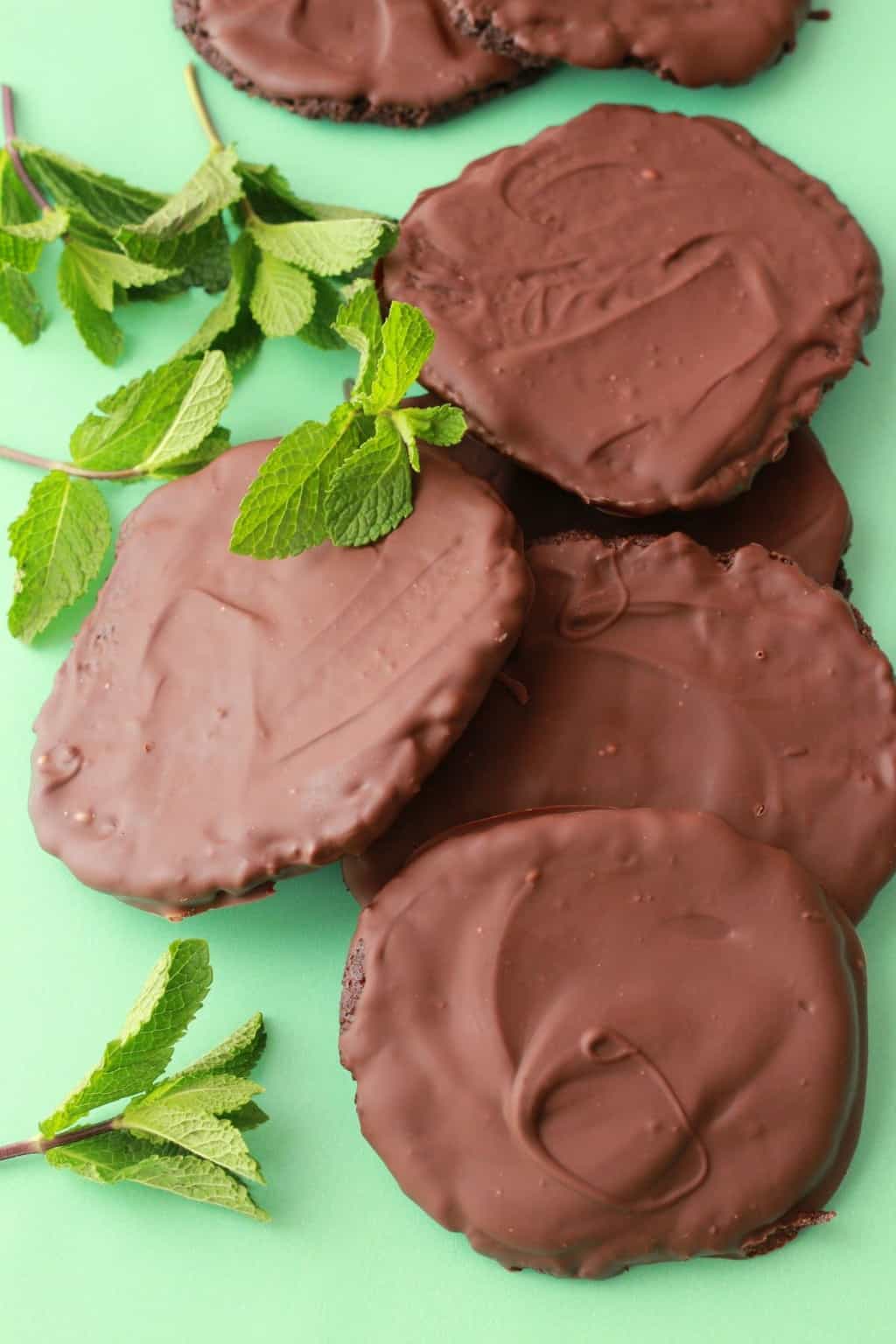 Vegan thin mint cookies with fresh mint leaves. 