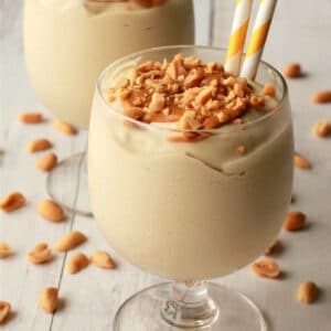 Vegan peanut butter milkshakes in glasses with straws.
