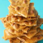 Vegan peanut brittle pieces in a stack.