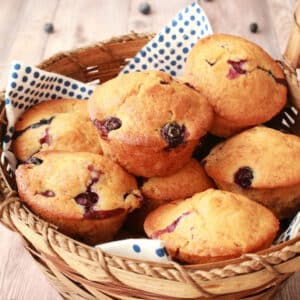 Vegan blueberry muffins in a basket.