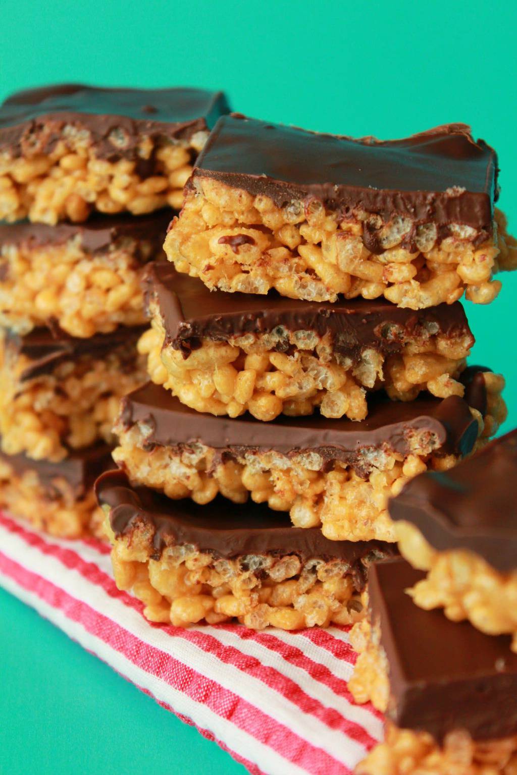 Chocolate topped rice krispie treats in stacks. 