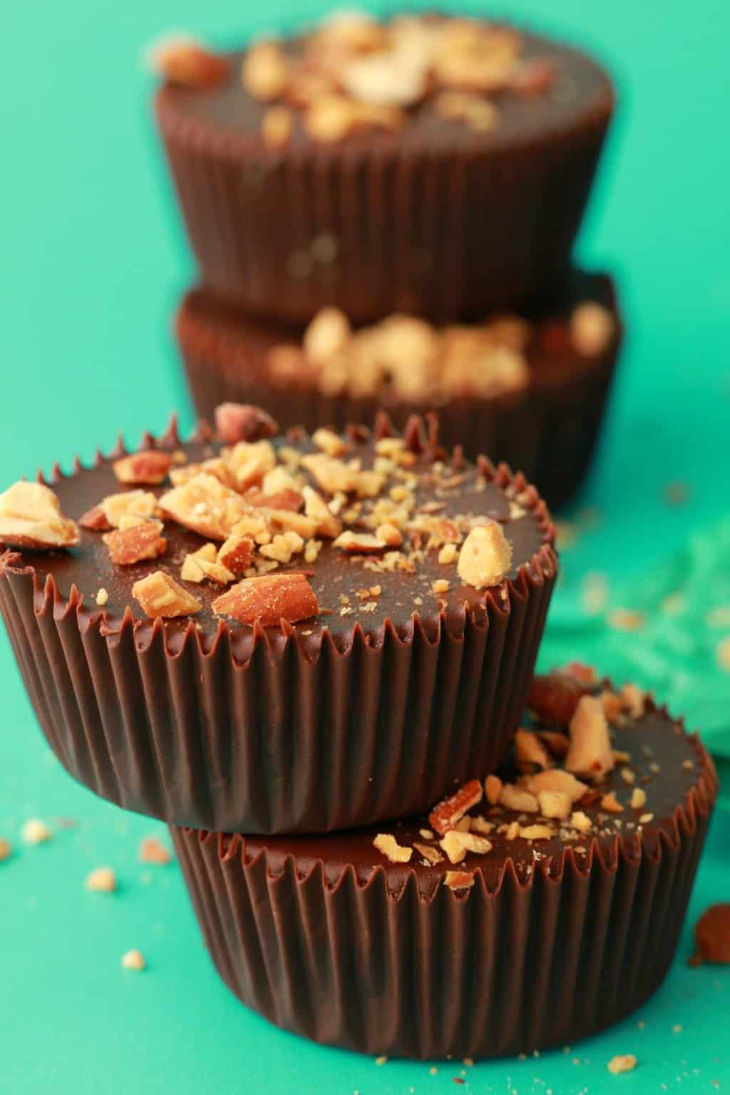 Vegan almond butter cups topped with crushed almonds. 