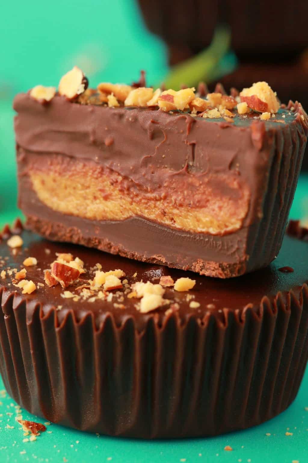 Vegan almond butter cup cut in half to show the inside. 