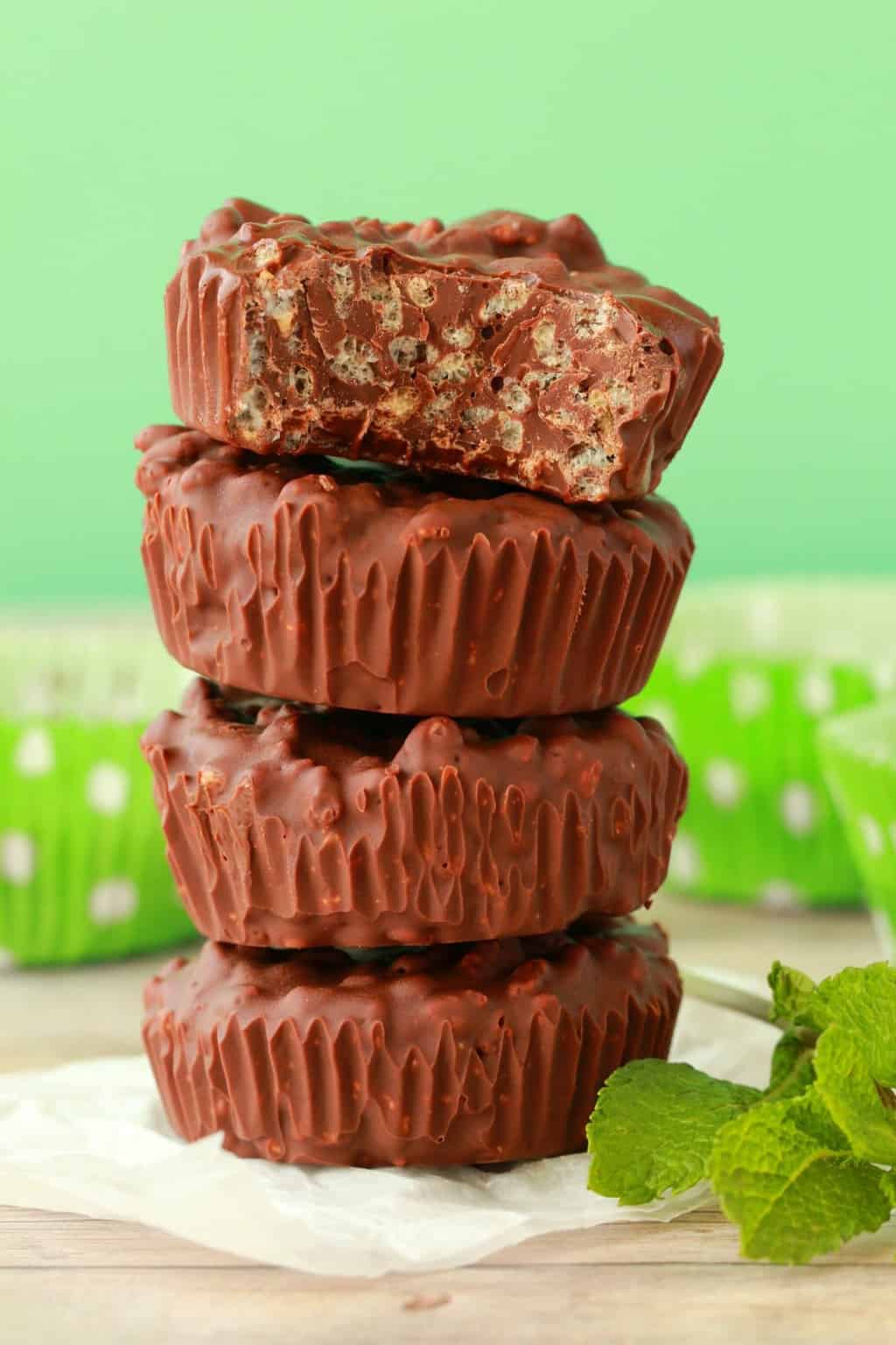 Chocolate mint crunch cups in a stack. 