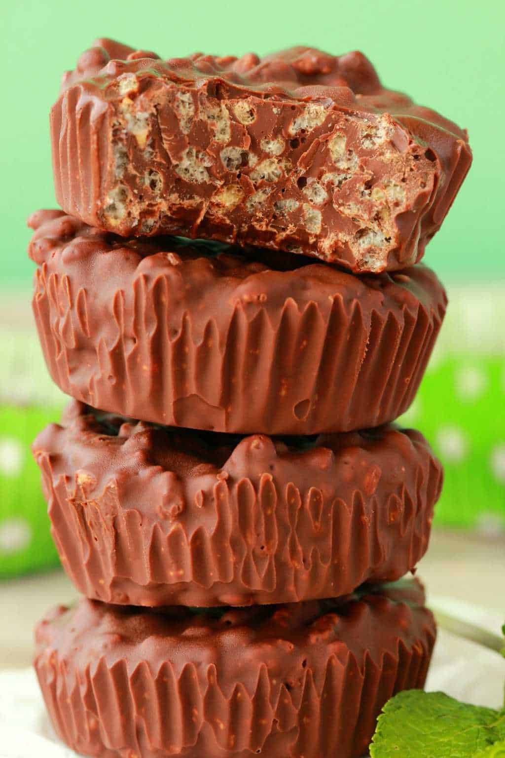 Chocolate mint crunch cups in a stack. 
