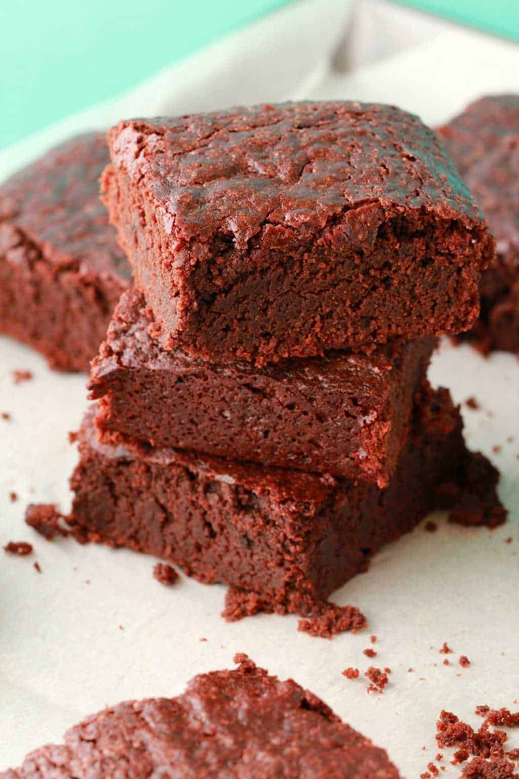 Vegan brownies stacked up on top of each other. 