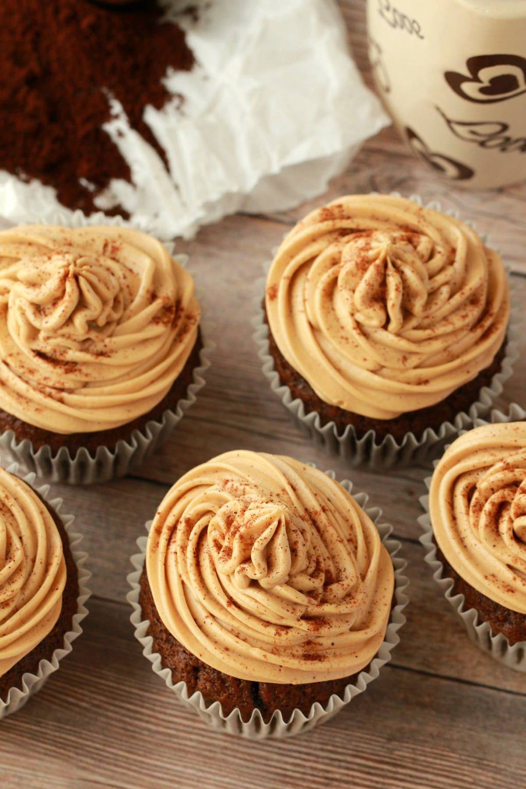 Vegan coffee cupcakes with coffee buttercream frosting and a sprinkle of cinnamon. 
