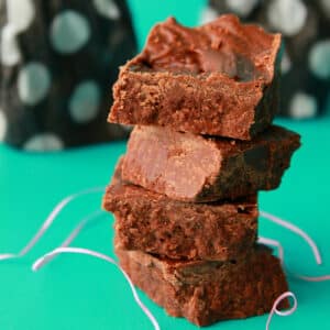 Old fashioned chocolate fudge squares in a stack.