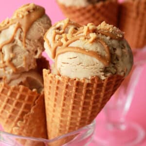 Vegan peanut butter ice cream in ice cream cones.