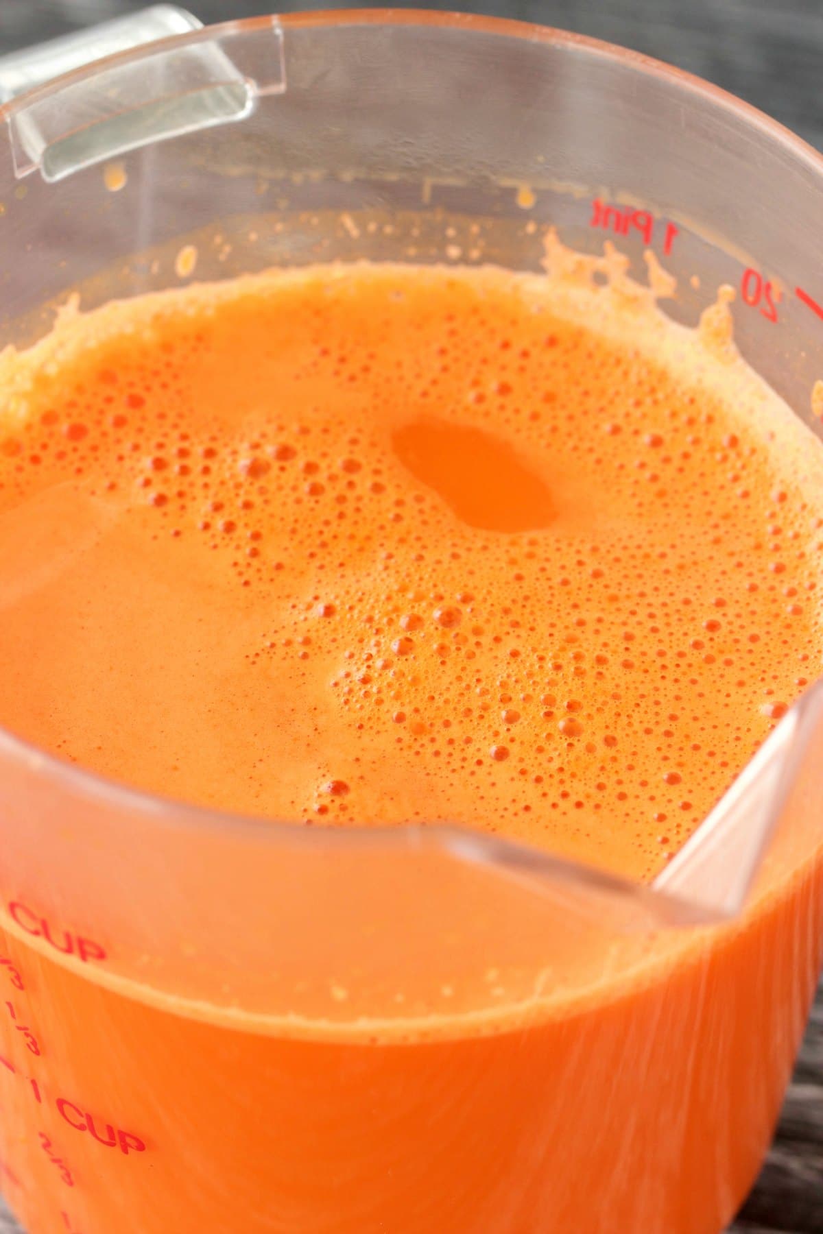 Fresh pressed carrot juice in a jug. 