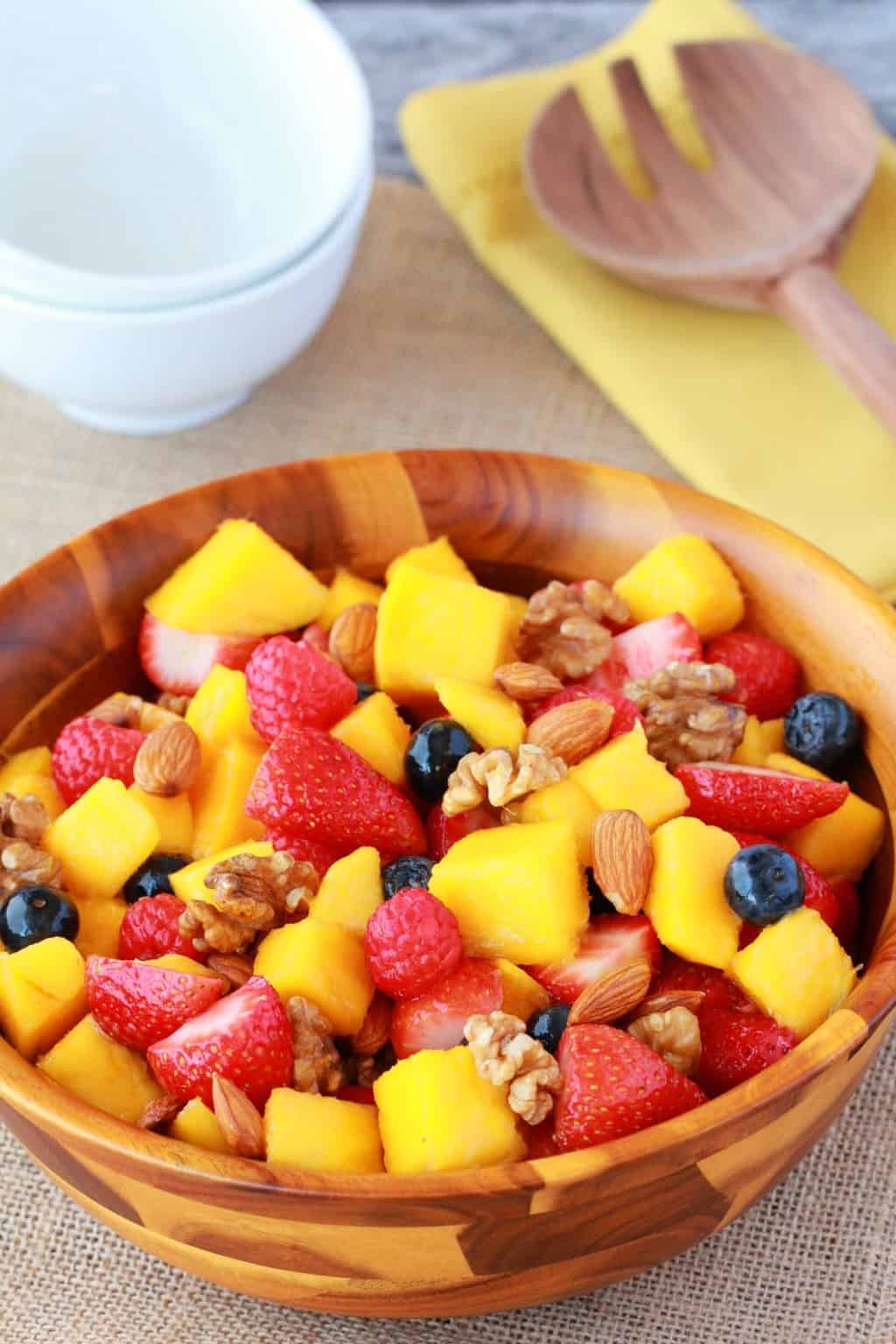 Fruit salad in a wooden bowl. 