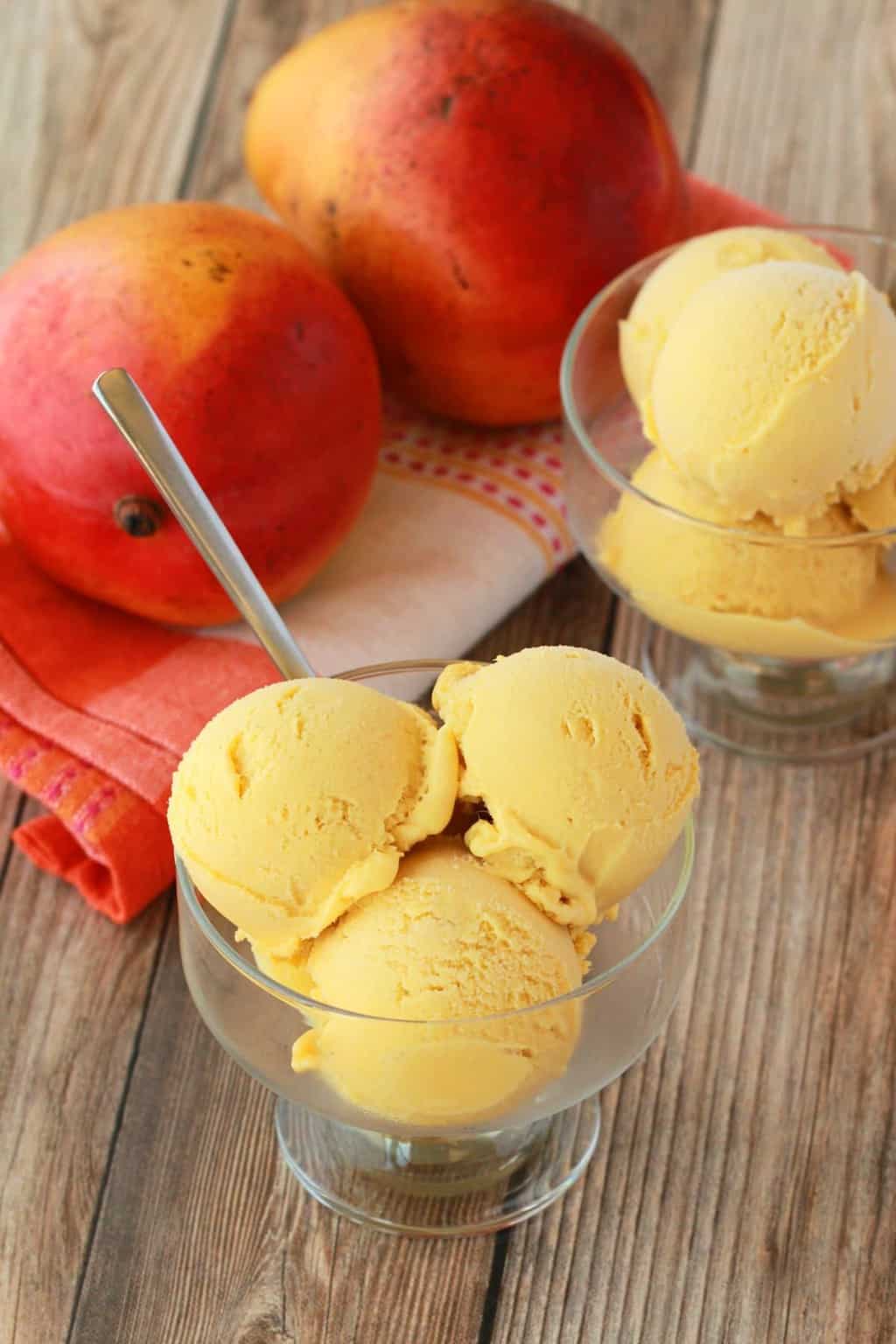Creamy and divinely textured vegan mango ice cream. This easy 5-ingredient recipe is perfectly sweet, a gorgeous color and has all the mango flavor you could dream of! #vegan #lovingitvegan #veganicecream #vegandessert #dairyfree #glutenfree | lovingitvegan.com