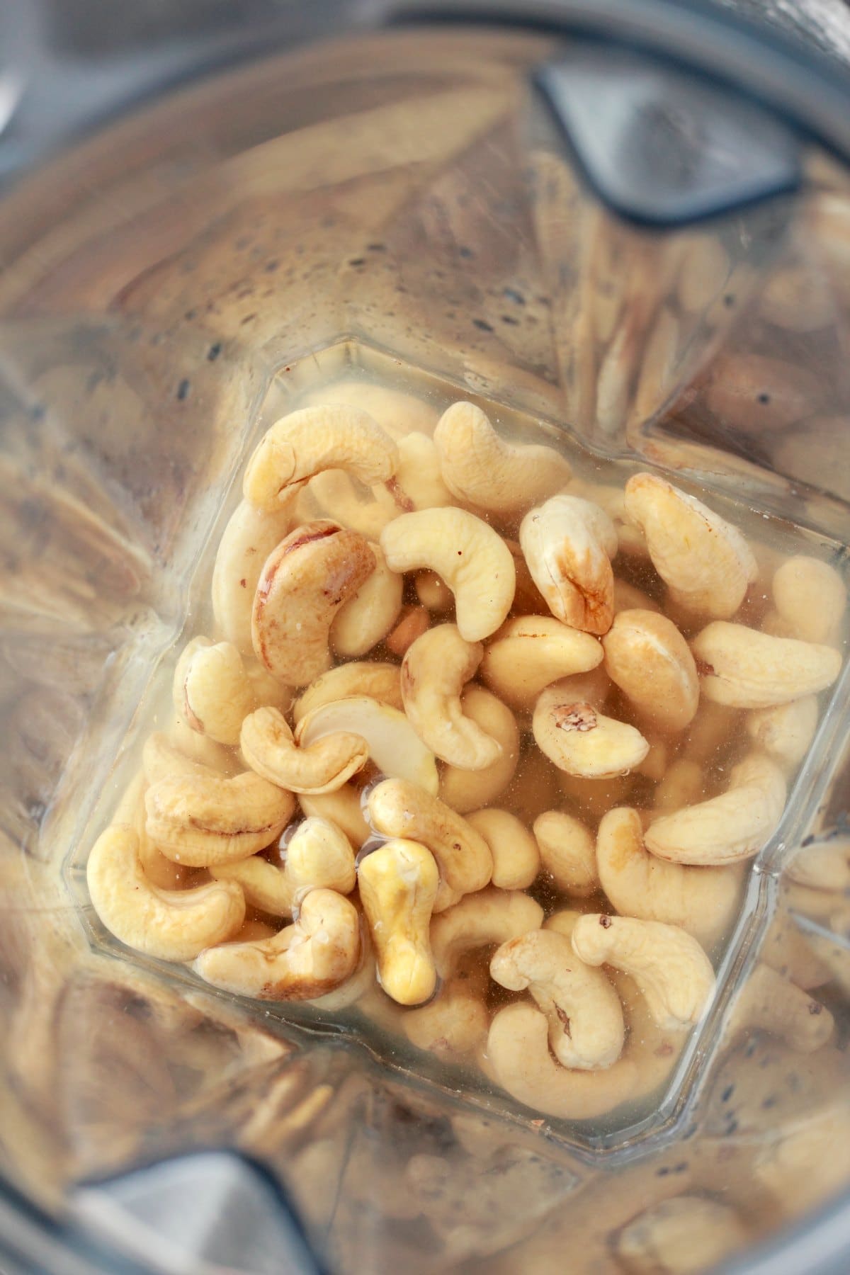 Cashews in a blender with water, lemon juice and salt. 