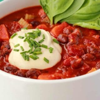 Vegan chili in a white bowl.