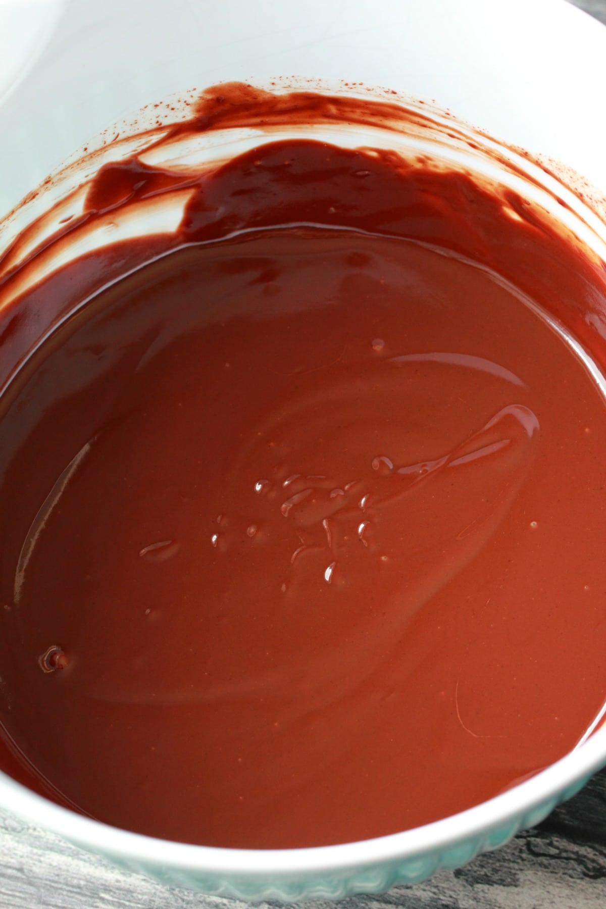 Chocolate ganache freshly made in a mixing bowl. 