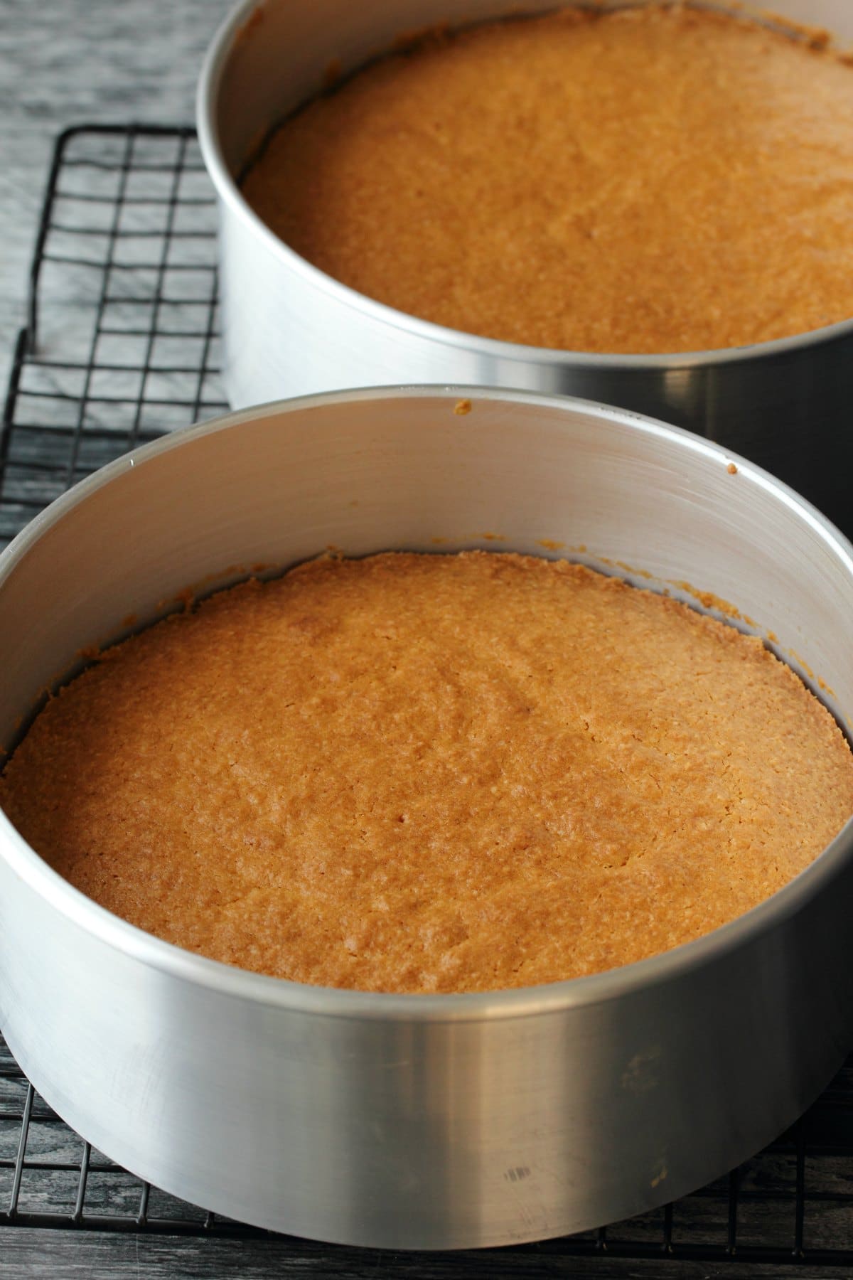 Freshly baked coconut cake in 8-inch round cake pans. 