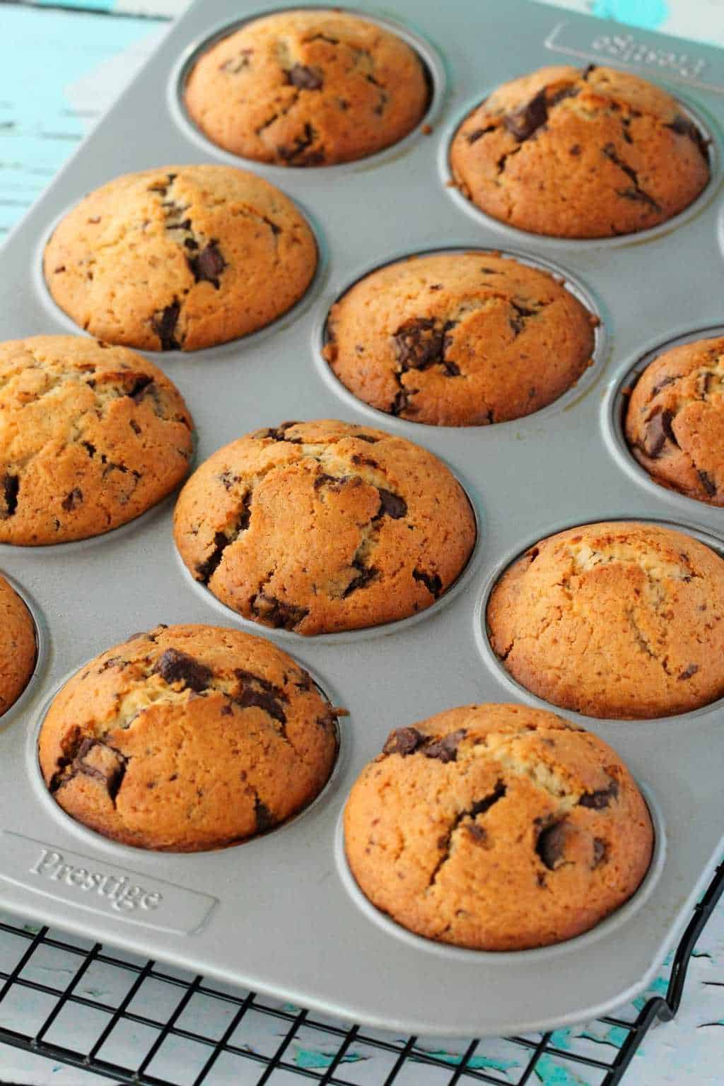 Vegan Chocolate Chip Muffins in a muffin tray freshly baked. 