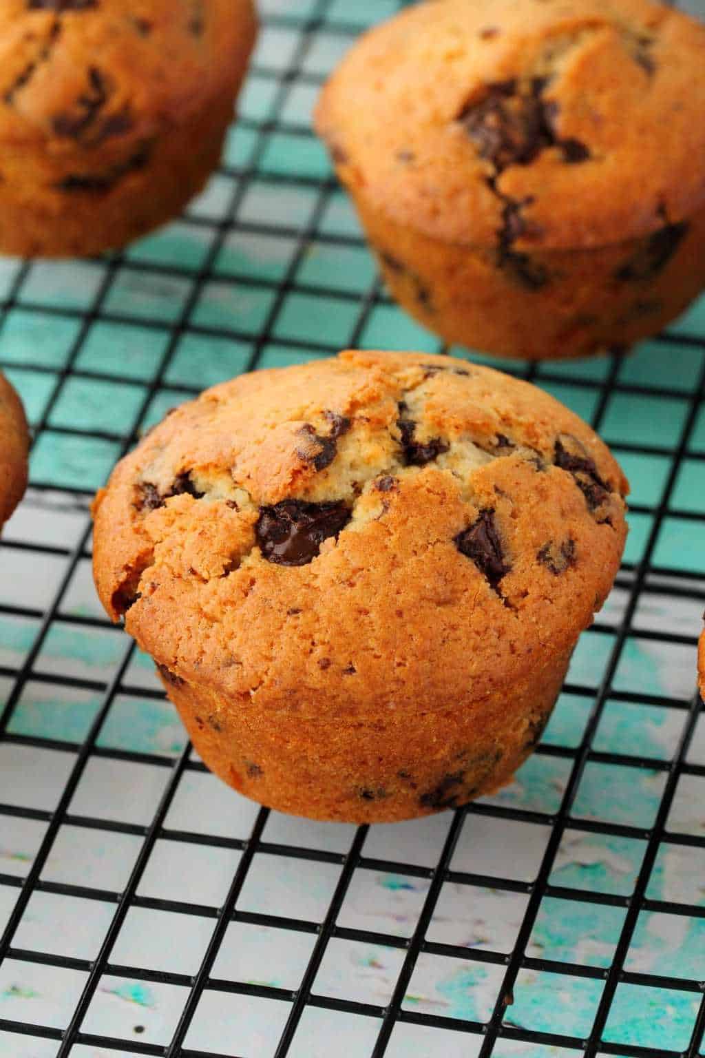Vegan Chocolate Chip Muffins on a wire cooling rack. 