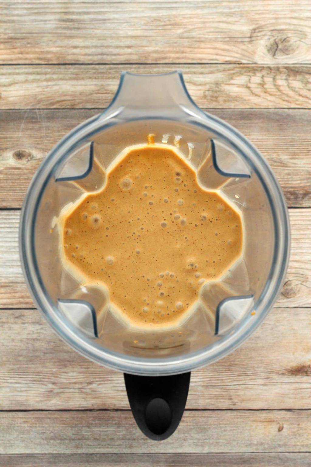 Vegan Coffee Smoothie freshly blended in a blender jug. 