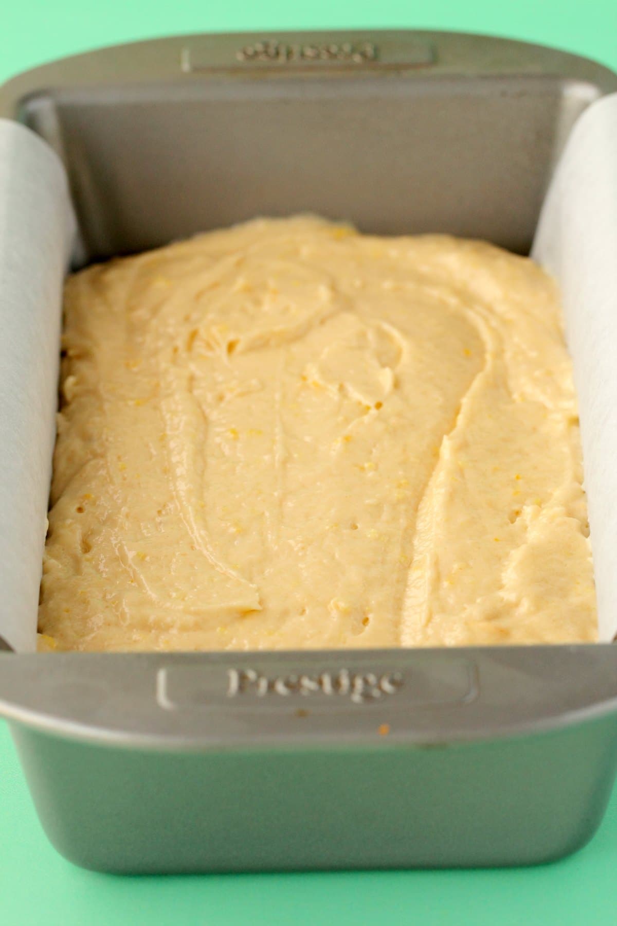 Batter for vegan lemon pound cake in a loaf pan. 