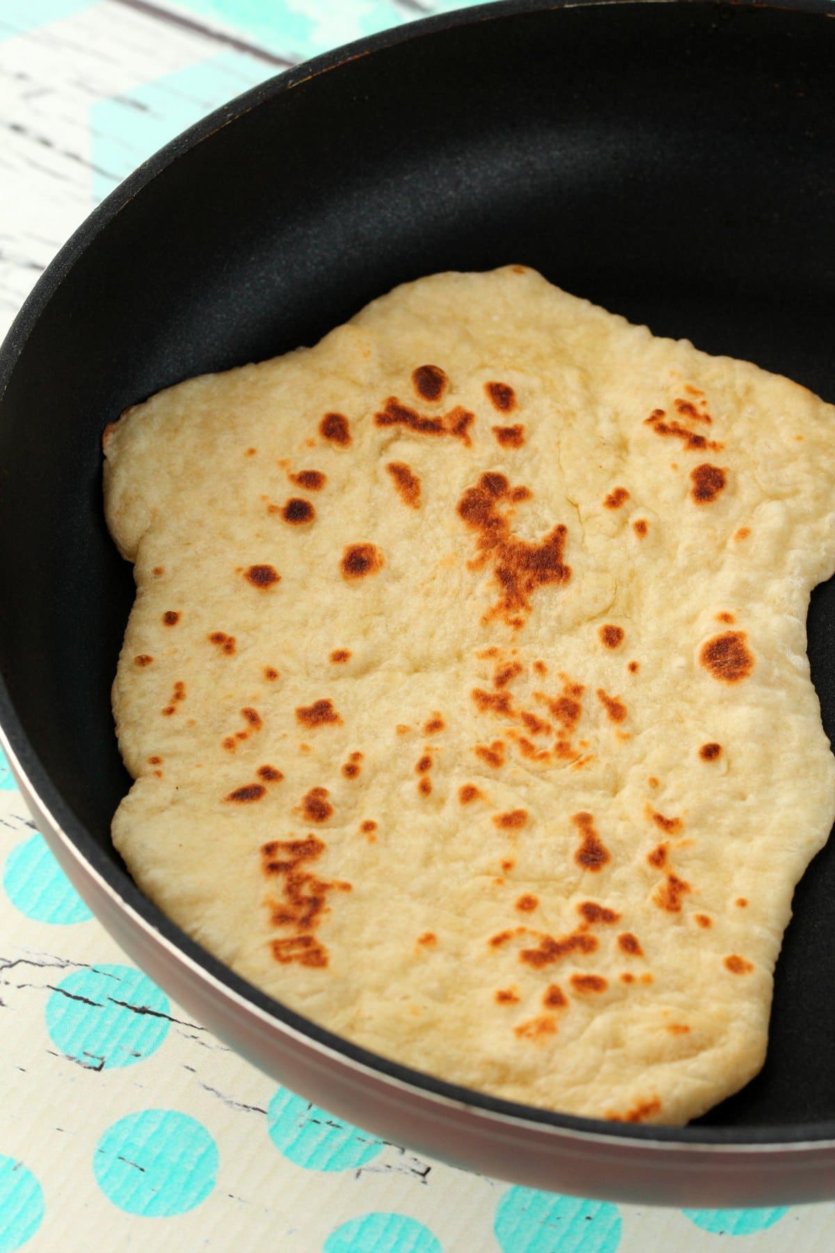 Vegan Naan in a frying pan. 