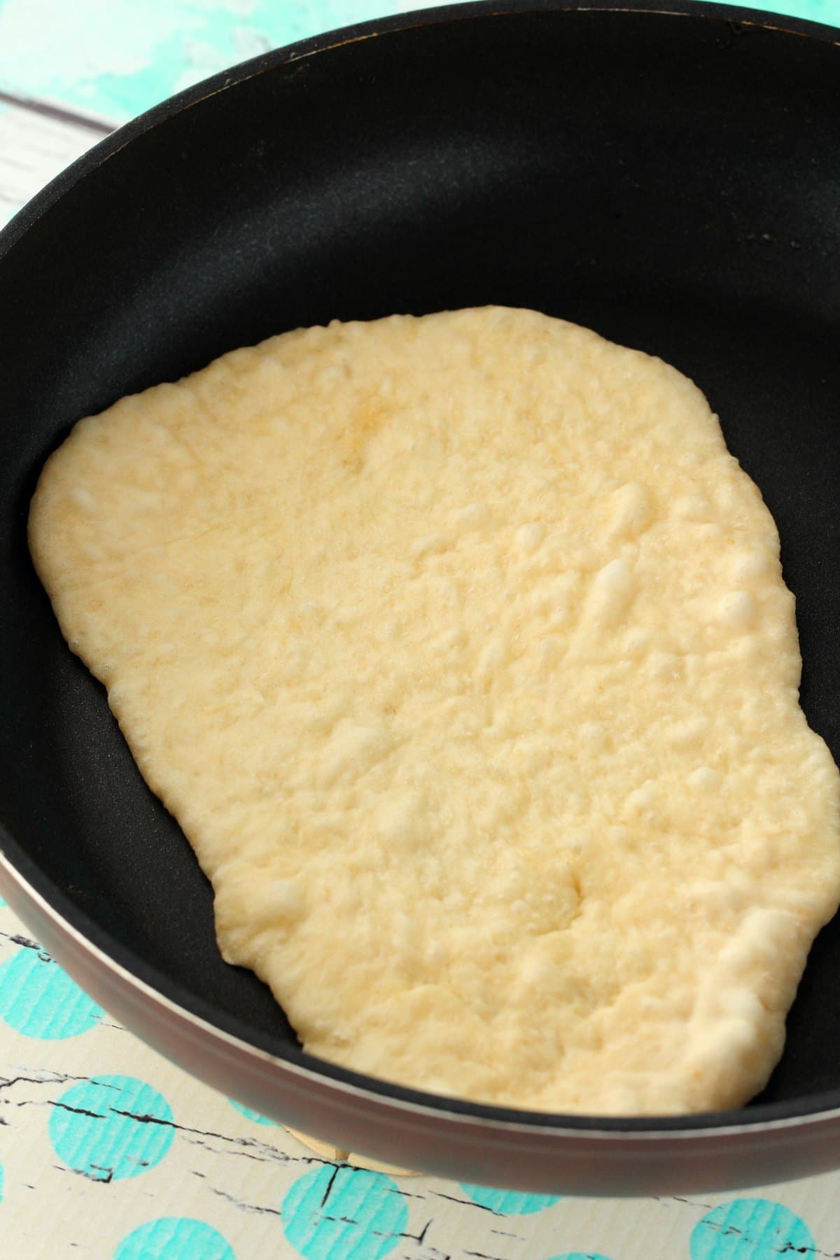 Vegan Naan in a frying pan. 