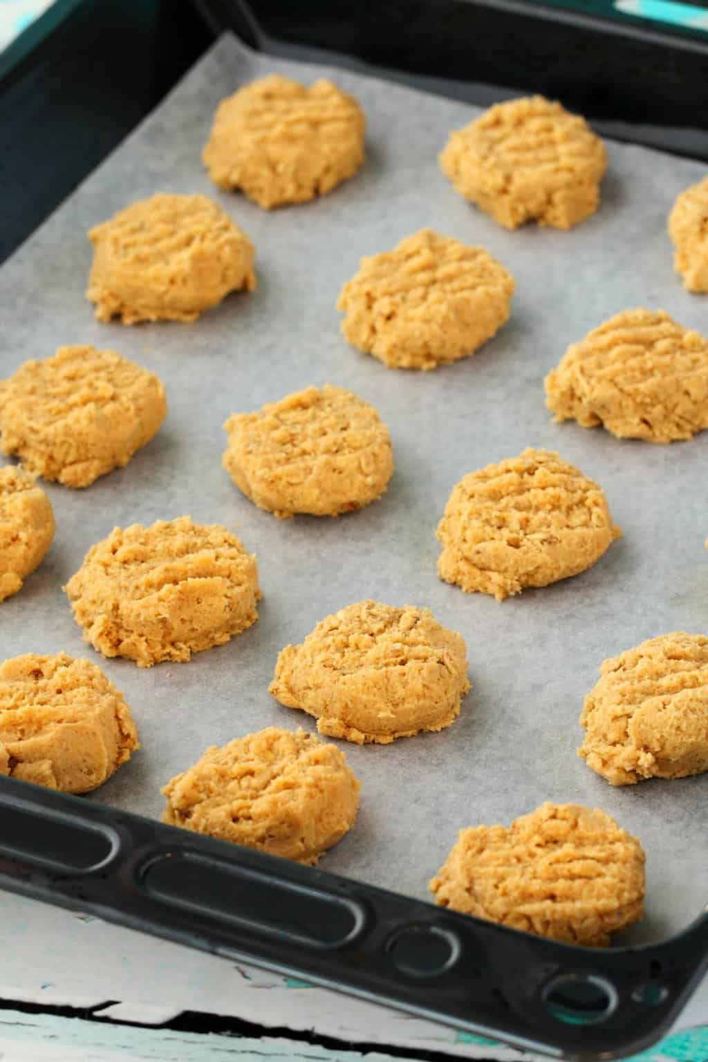Vegan Peanut Butter Oatmeal Cookies on a baking tray, ready to go into the oven. 