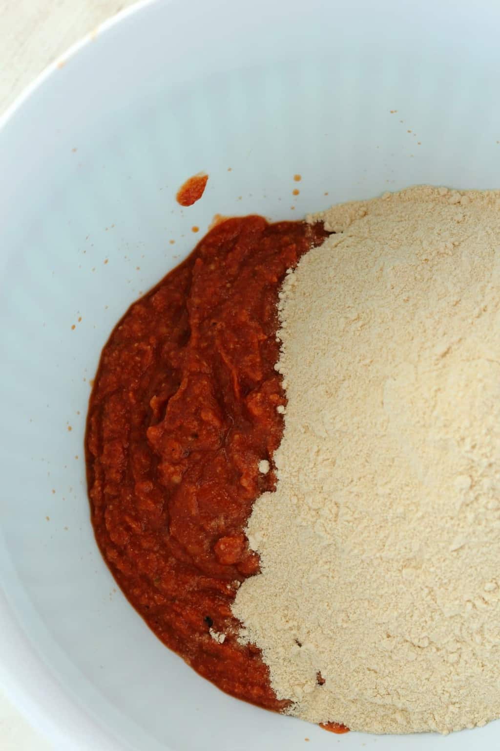 Vital wheat gluten powder and other ingredients in a mixing bowl - making seitan for vegan shawarmas.