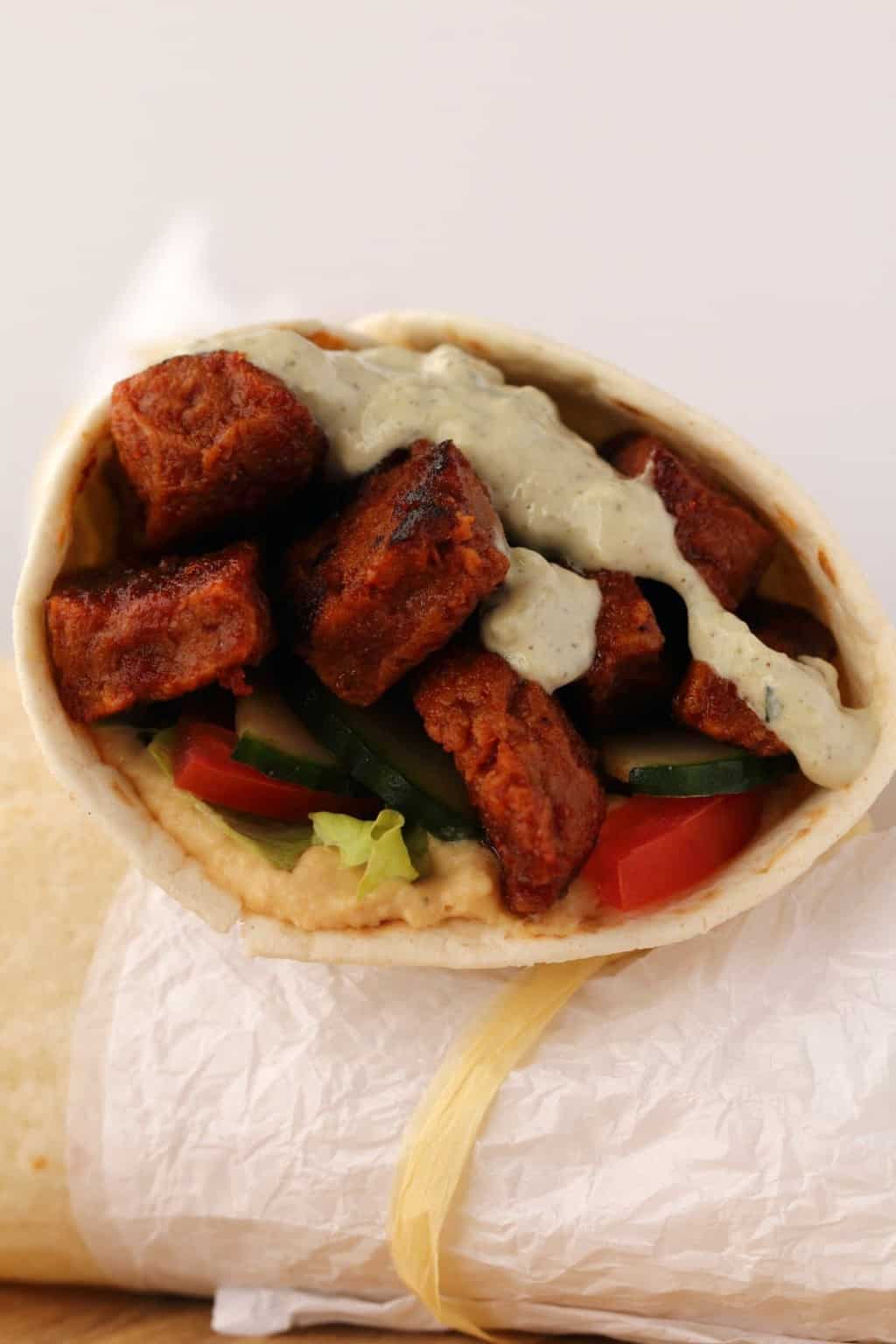 Vegan Shawarma stuffed with seitan and veggies and topped with vegan tzatziki. 