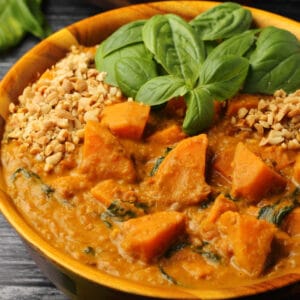 Vegan sweet potato curry in a wooden bowl.