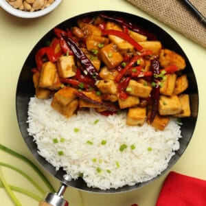 Kung pao tofu with basmati rice in a skillet.