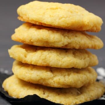 Vegan coconut cookies in a stack.
