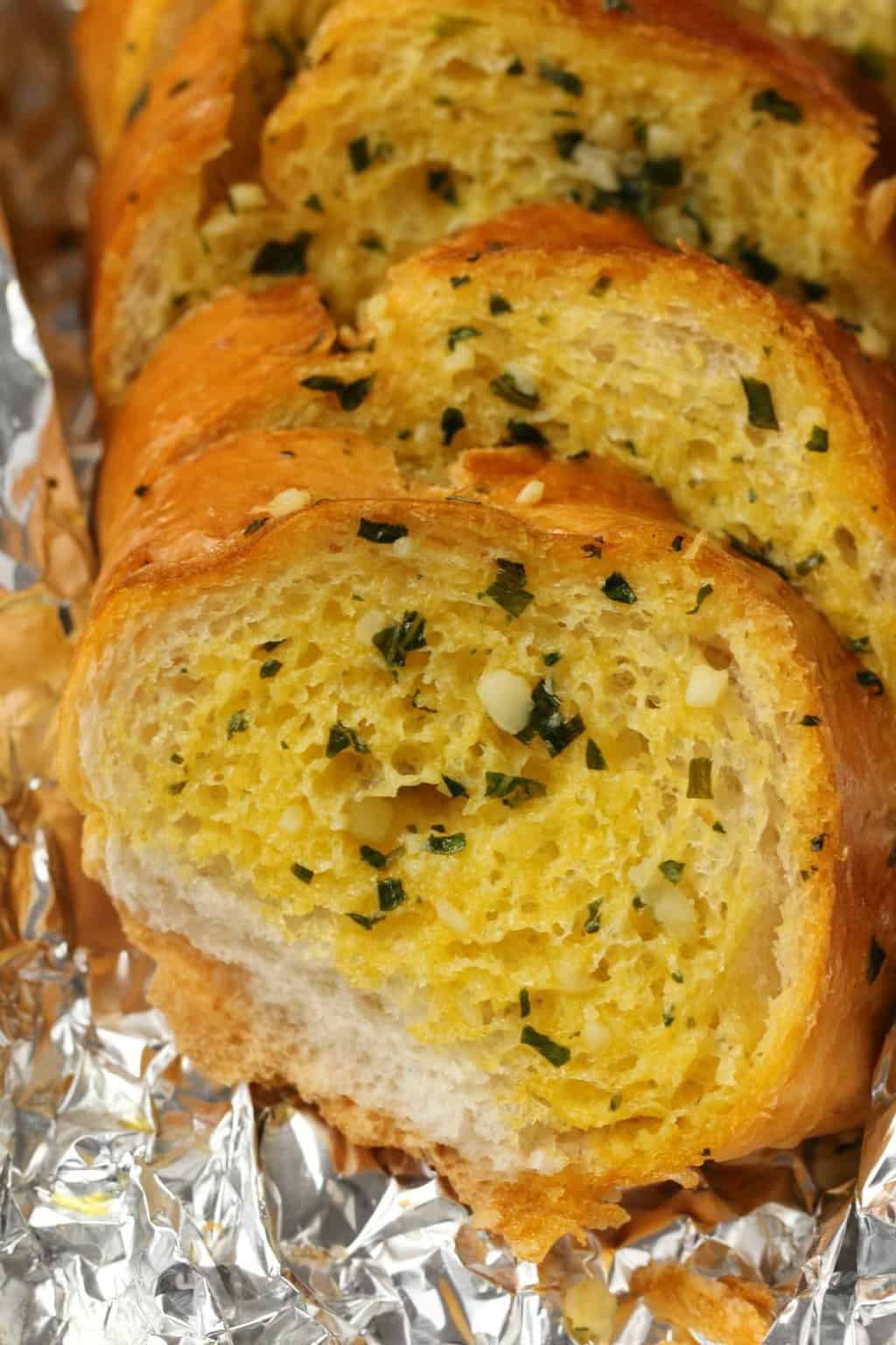 Freshly baked vegan garlic bread in foil. 