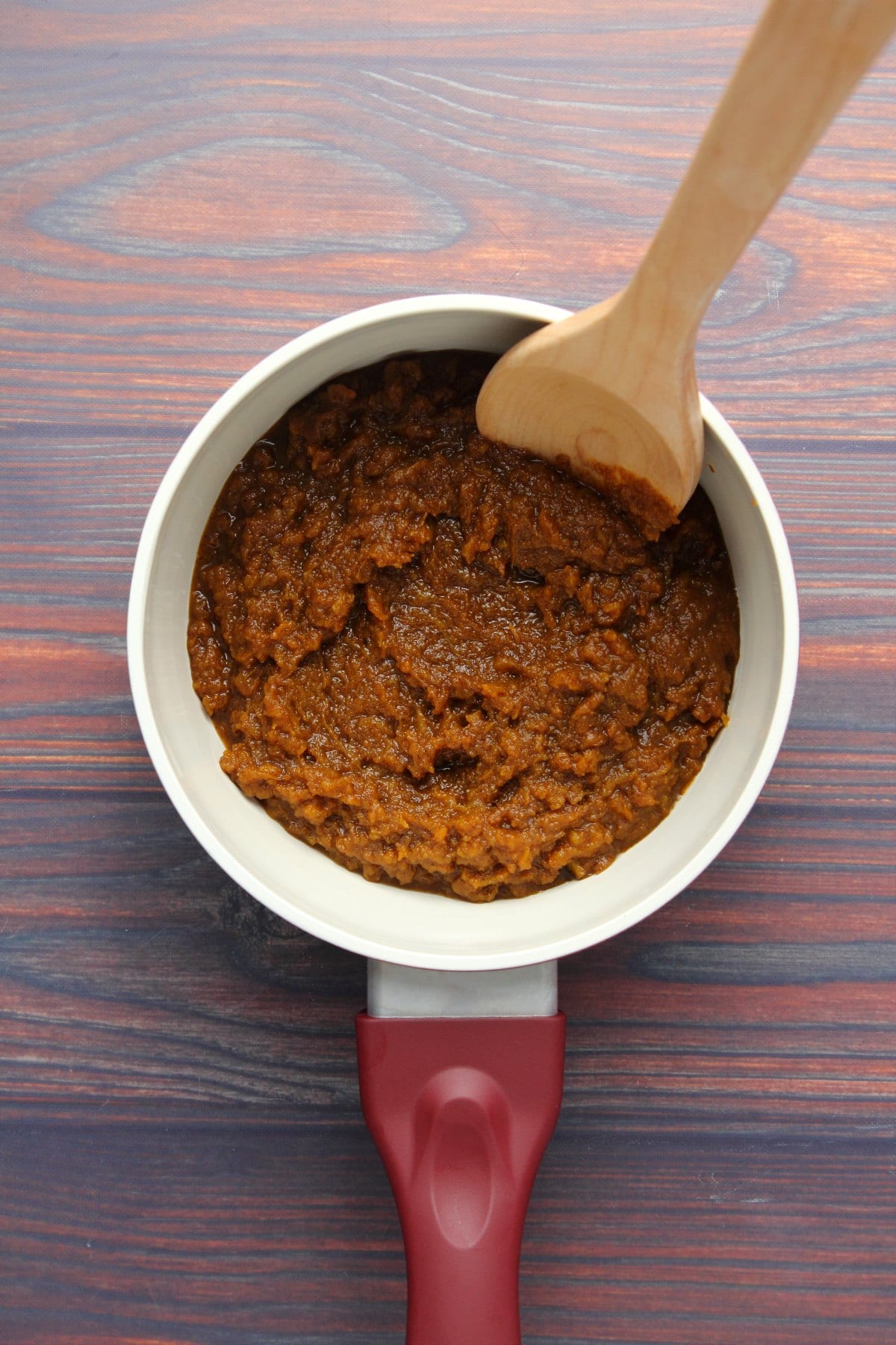 Pumpkin purée, brown sugar and pumpkin pie spice cooked together in a pot.