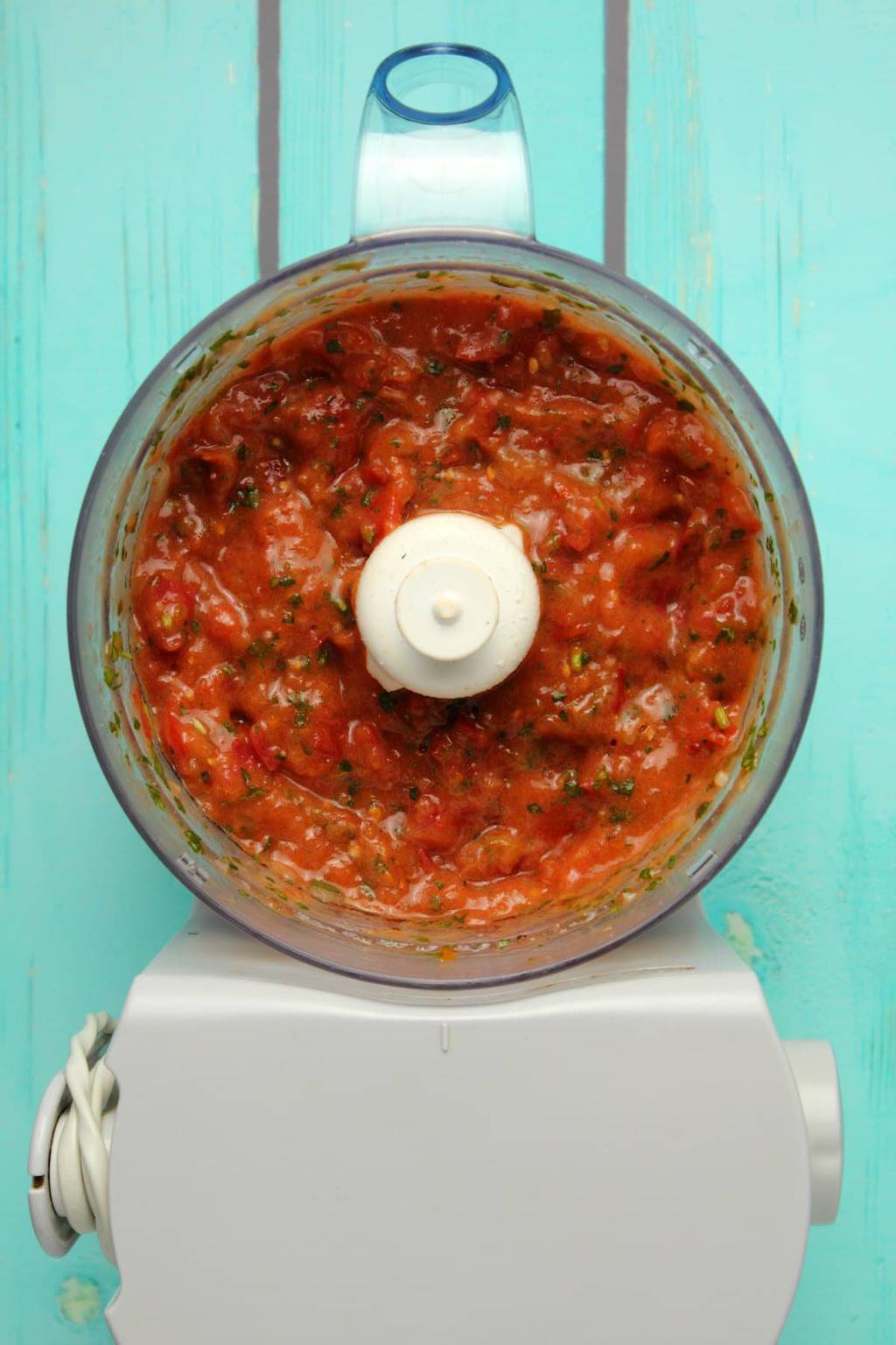 Homemade salsa in a food processor. 