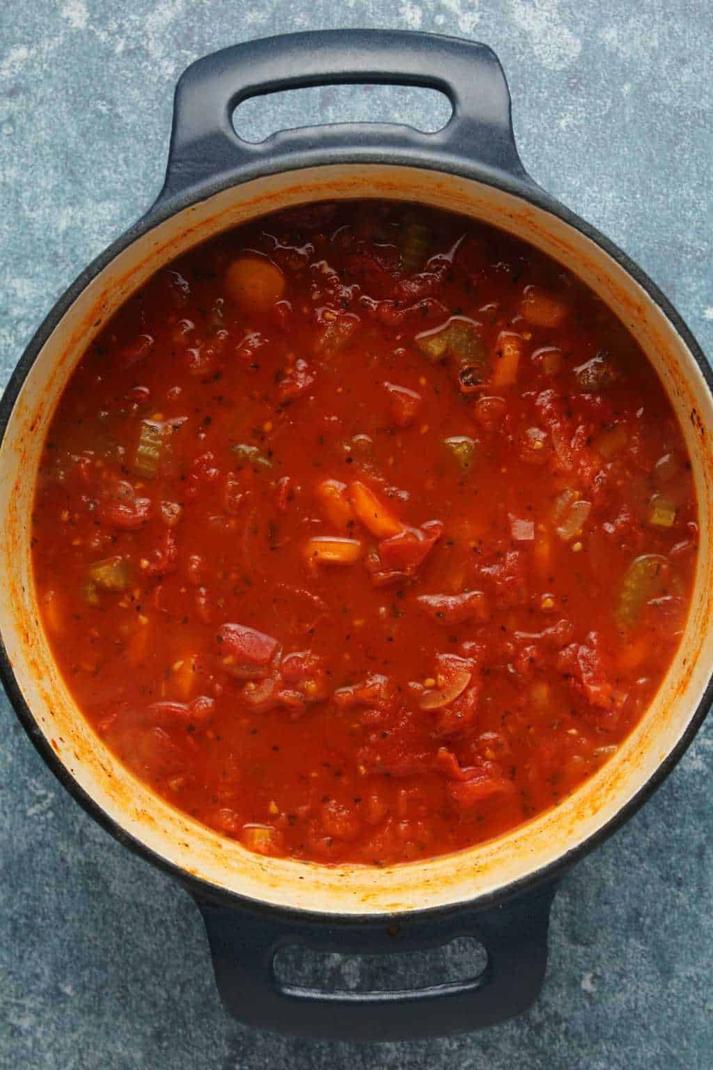 Vegan tomato basil soup in a cast iron pot. 