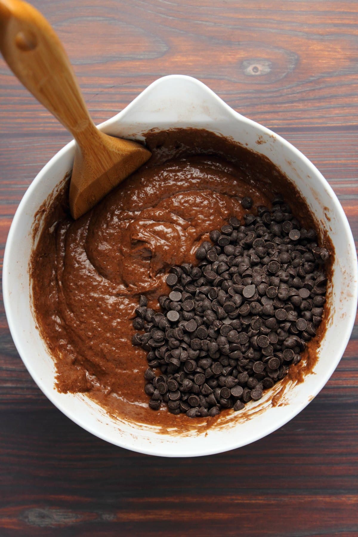 Chocolate chips added to batter in mixing bowl.